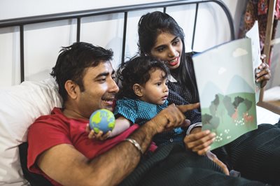 Parents reading to child